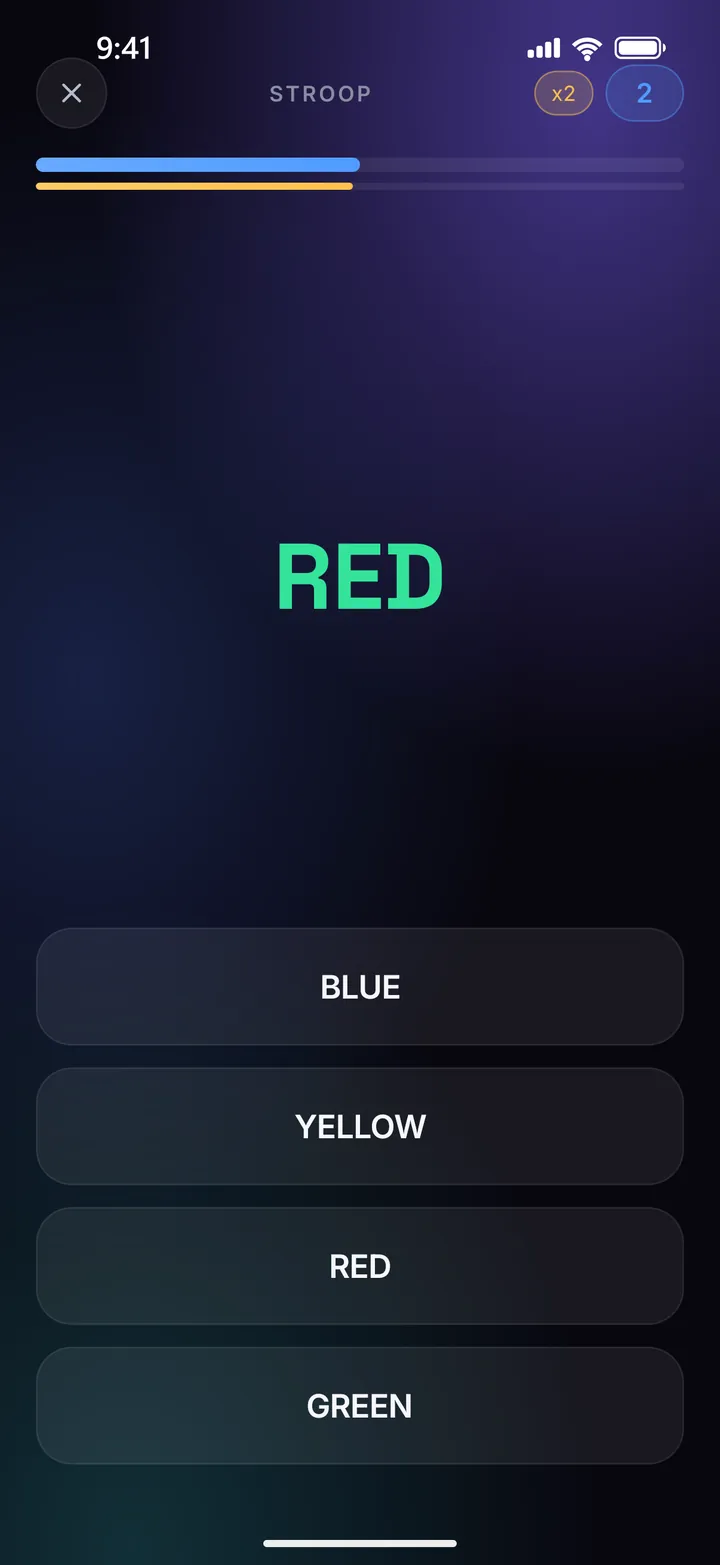 The Stroop board: the word RED printed in green ink above four colour buttons